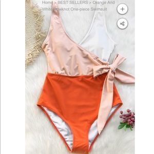 Orange and White one piece bow knot swim suit.